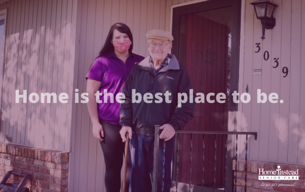 Young woman with mask with senior man. Text overlay says "Home is the best place to be"